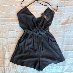 Black small summer short Lulu’s halter tie romper with pockets